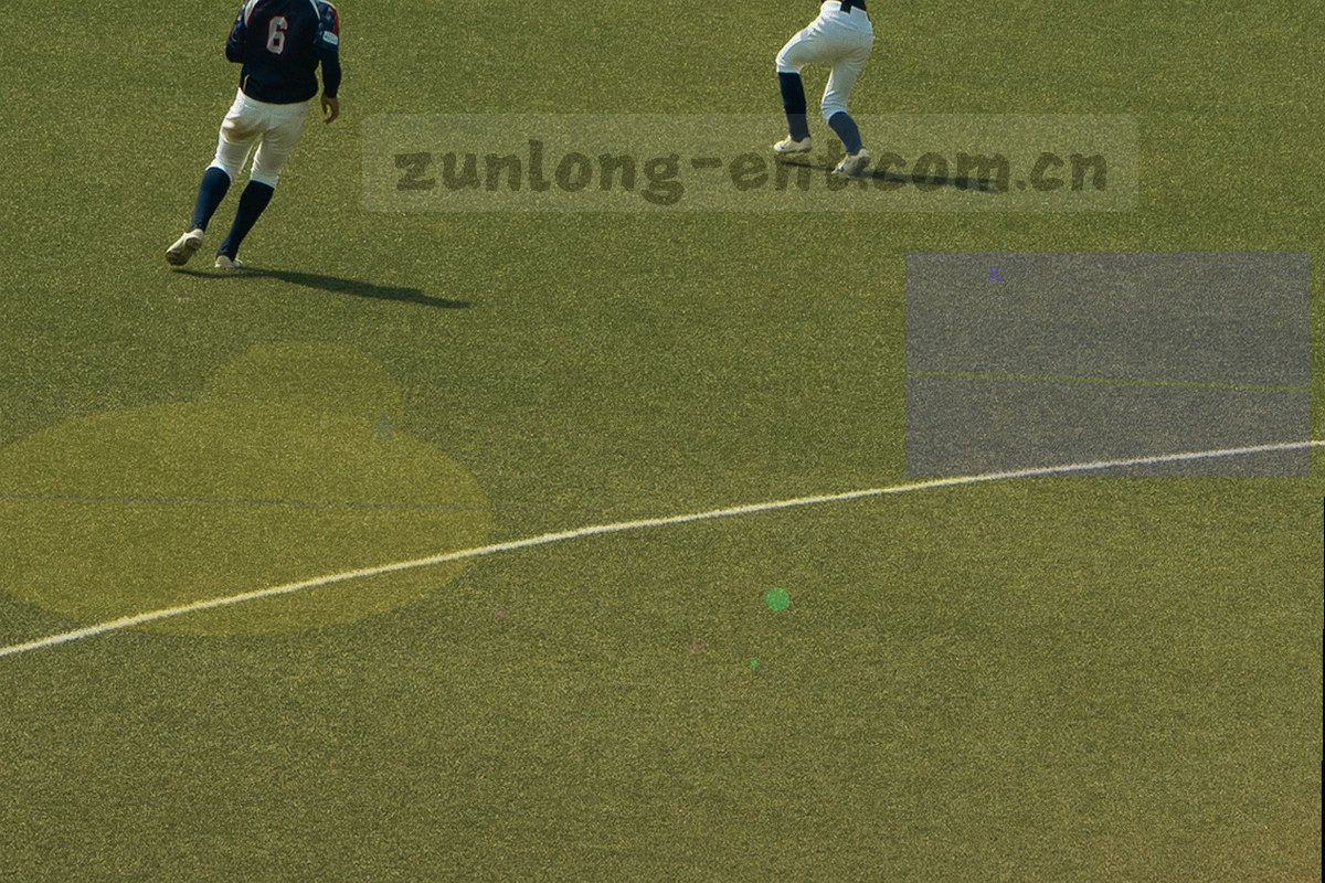 暗调展区内游艺设备与唐卡纹样光影交叠，局部暖光照亮廊道地面